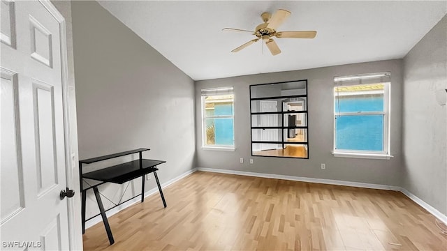 17942 Oakmont Ridge Cir, Fort Myers, FL 33967 - unfurnished room with light wood-type flooring, a ceiling fan, baseboards, and lofted ceiling