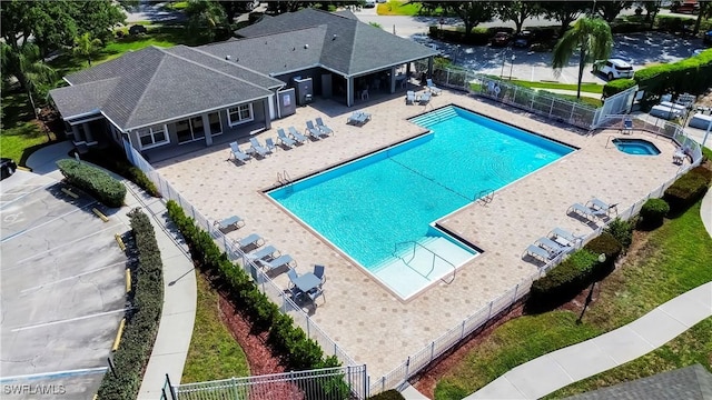 17942 Oakmont Ridge Cir, Fort Myers, FL 33967 - community pool with a fenced backyard, a community hot tub, and a patio area