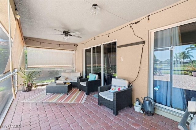view of patio with ceiling fan and an outdoor living space