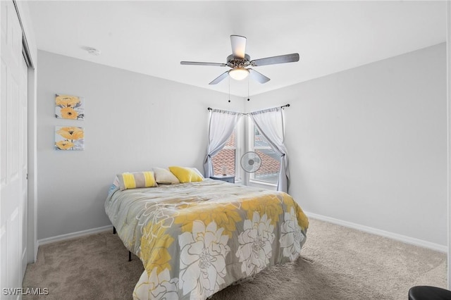 bedroom with a closet, baseboards, and carpet floors