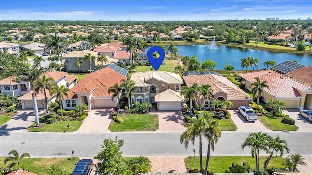 aerial view with a water view and a residential view