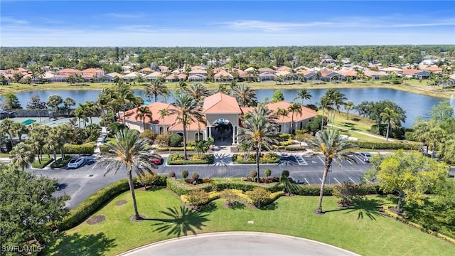 birds eye view of property featuring a water view and a residential view