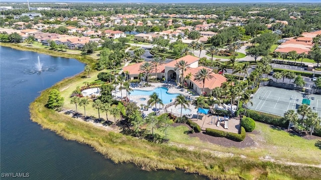 drone / aerial view featuring a water view and a residential view