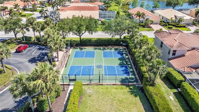 drone / aerial view with a water view and a residential view