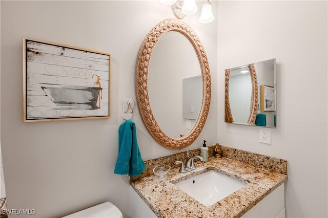 half bathroom with toilet and a sink