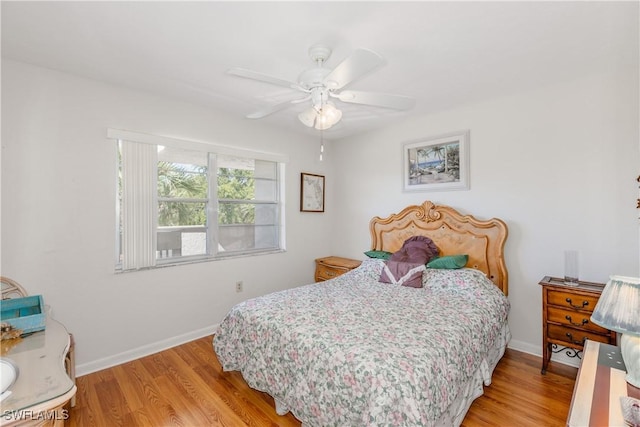 bedroom with baseboards, light wood-style flooring, and ceiling fan