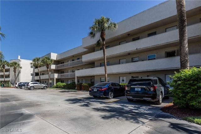 view of property with uncovered parking
