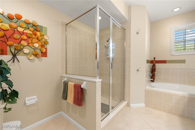 full bath featuring recessed lighting, tile patterned floors, a garden tub, and a stall shower
