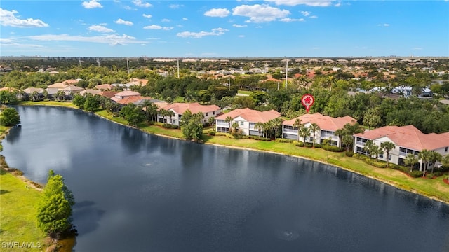 drone / aerial view with a water view and a residential view