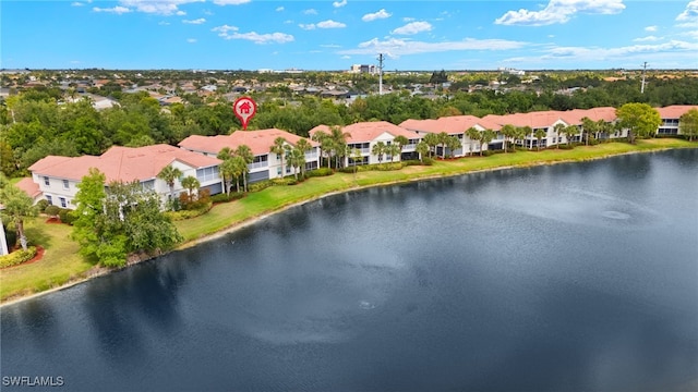 drone / aerial view with a water view and a residential view