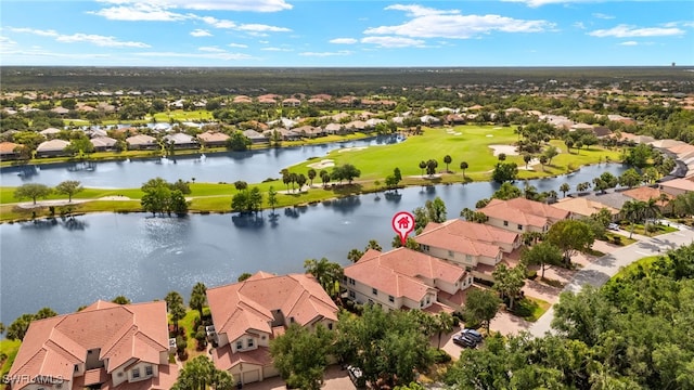 birds eye view of property featuring a water view, golf course view, and a residential view