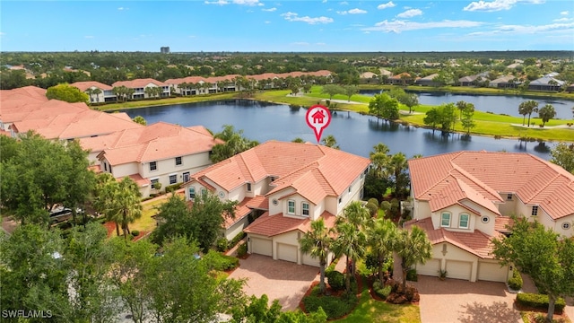 drone / aerial view with a residential view and a water view