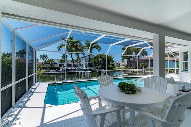 931 Snowberry Ct, Marco Island, FL 34145 - outdoor pool featuring outdoor dining area, a water view, a patio area, and a lanai