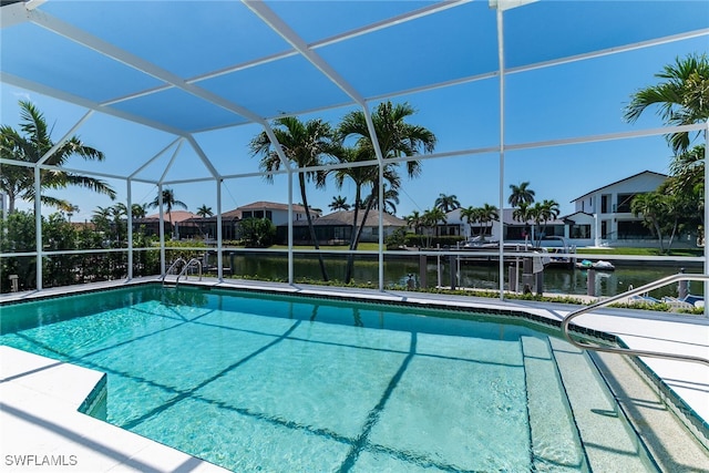 931 Snowberry Ct, Marco Island, FL 34145 - outdoor pool featuring a water view, a lanai, and a residential view