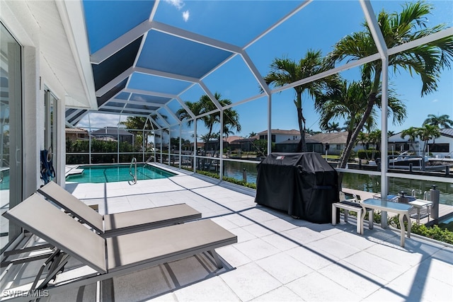 931 Snowberry Ct, Marco Island, FL 34145 - pool featuring glass enclosure, a water view, a patio area, and a grill