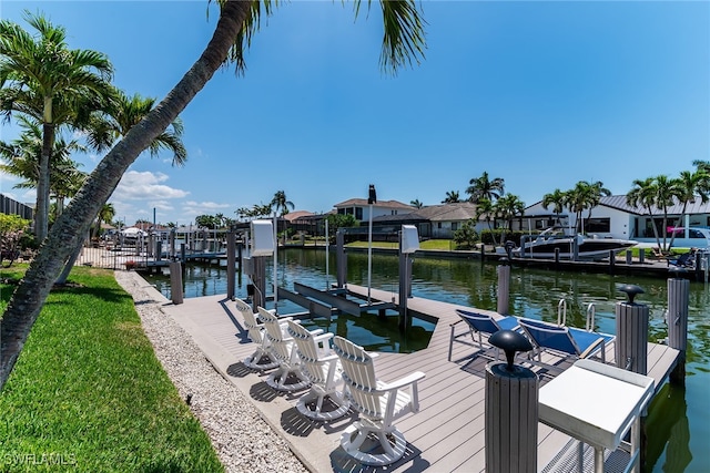 931 Snowberry Ct, Marco Island, FL 34145 - dock area with a water view, boat lift, and a residential view