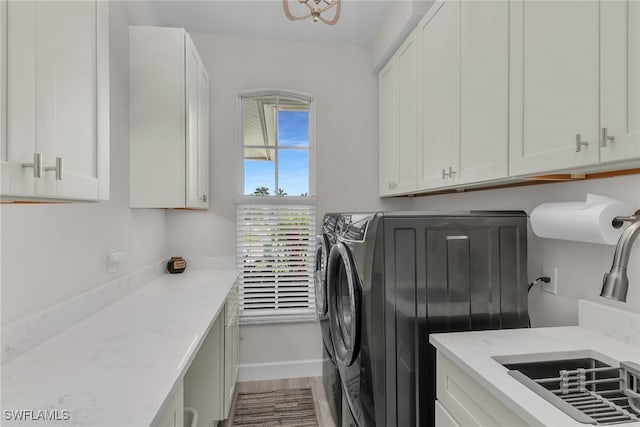 931 Snowberry Ct, Marco Island, FL 34145 - clothes washing area with a sink, cabinet space, and independent washer and dryer
