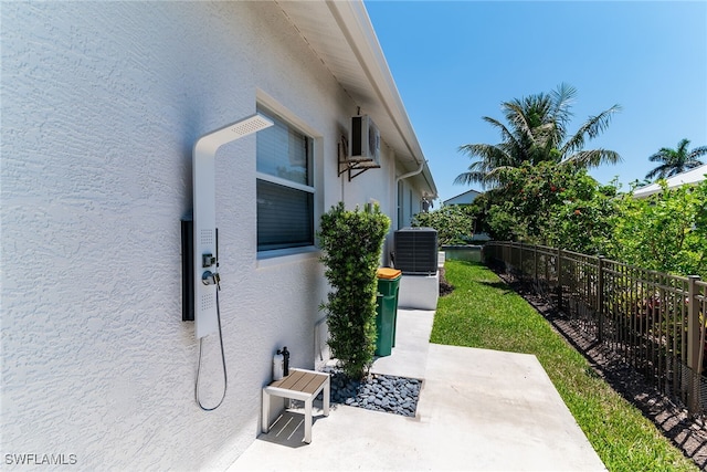 931 Snowberry Ct, Marco Island, FL 34145 - view of home's exterior featuring central air condition unit, a patio, fence, and stucco siding