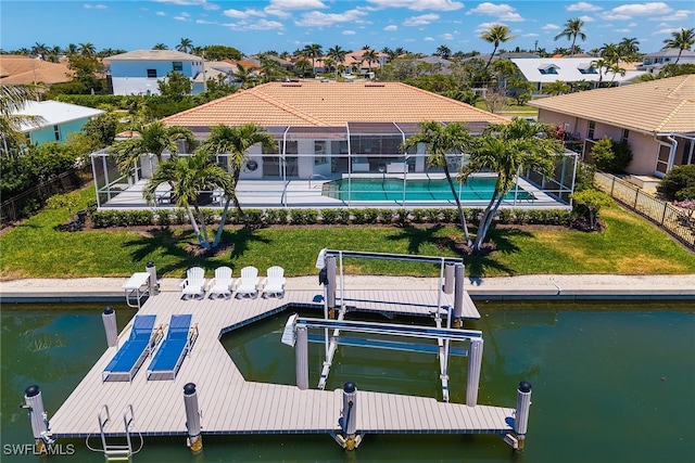 931 Snowberry Ct, Marco Island, FL 34145 - dock area featuring fence, boat lift, a lawn, and a residential view