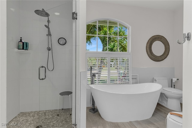 931 Snowberry Ct, Marco Island, FL 34145 - bathroom featuring toilet, a freestanding tub, and a shower stall