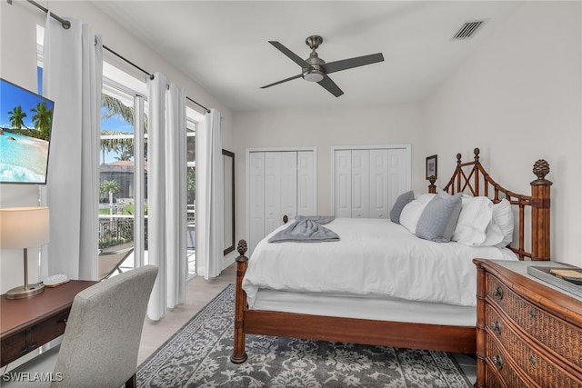 931 Snowberry Ct, Marco Island, FL 34145 - bedroom with visible vents, ceiling fan, two closets, and wood finished floors