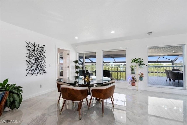 dining space with recessed lighting, baseboards, visible vents, and marble finish floor