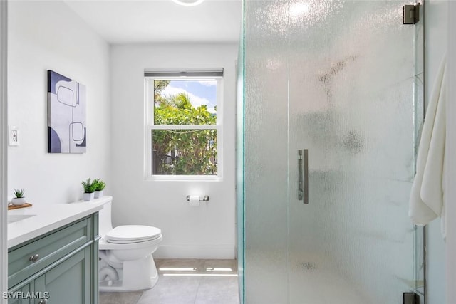 full bath featuring vanity, tile patterned flooring, a stall shower, and toilet