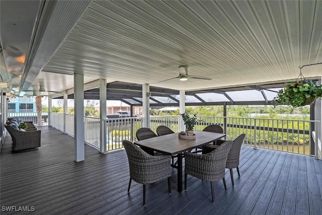 wooden deck featuring a ceiling fan and outdoor dining area
