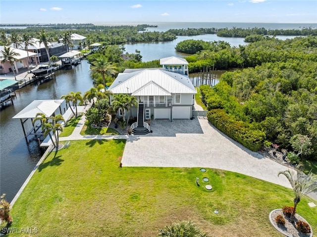 birds eye view of property featuring a water view