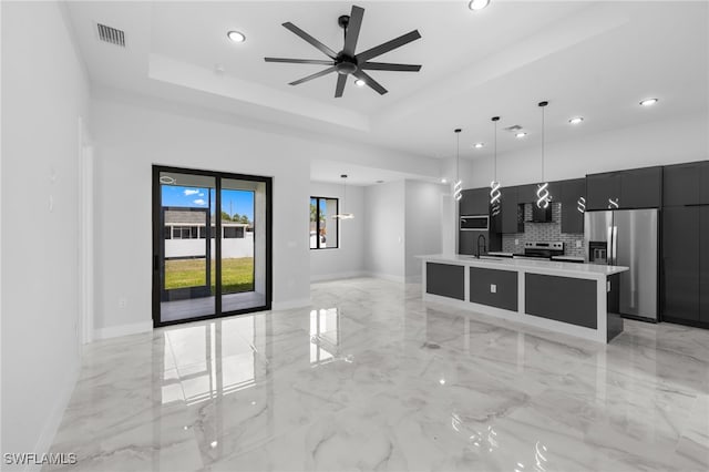 kitchen with dark cabinetry, modern cabinets, stainless steel appliances, and recessed lighting