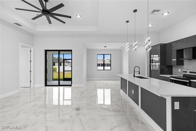 kitchen featuring modern cabinets, a sink, electric stove, marble finish floor, and dark cabinets