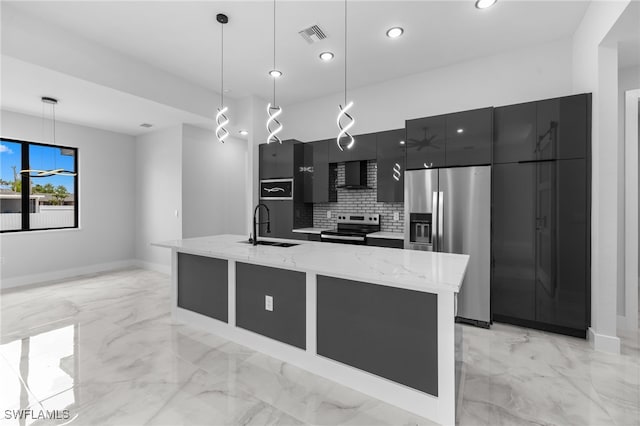 kitchen with dark cabinetry, modern cabinets, stainless steel appliances, and marble finish floor