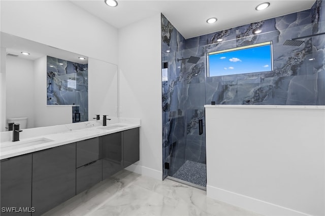bathroom with recessed lighting, a marble finish shower, a sink, and marble finish floor