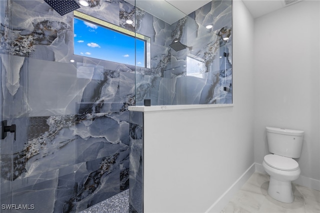full bath with a marble finish shower, baseboards, toilet, and marble finish floor