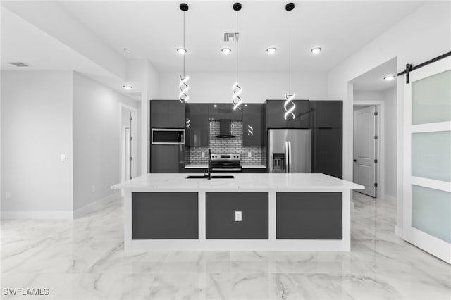 kitchen with a sink, dark cabinets, stainless steel appliances, visible vents, and modern cabinets
