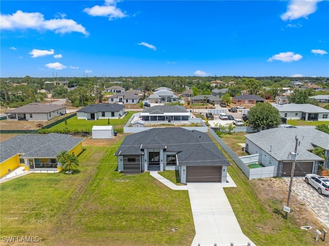 birds eye view of property with a residential view
