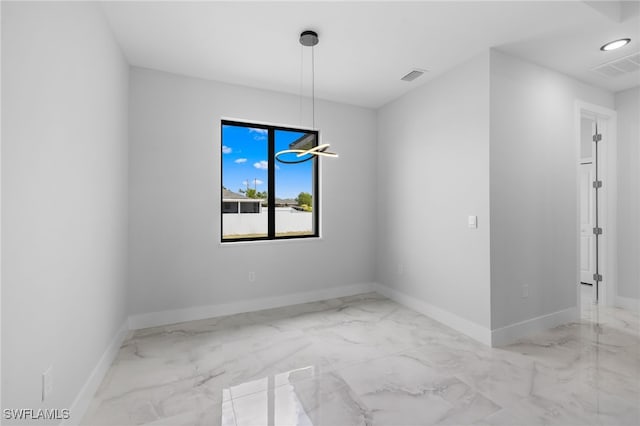 unfurnished room featuring visible vents, marble finish floor, and baseboards