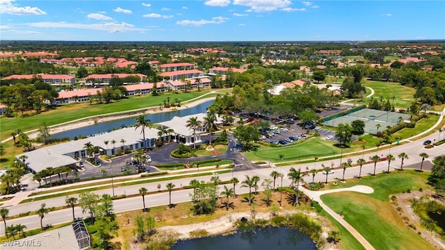 bird's eye view featuring a water view and golf course view