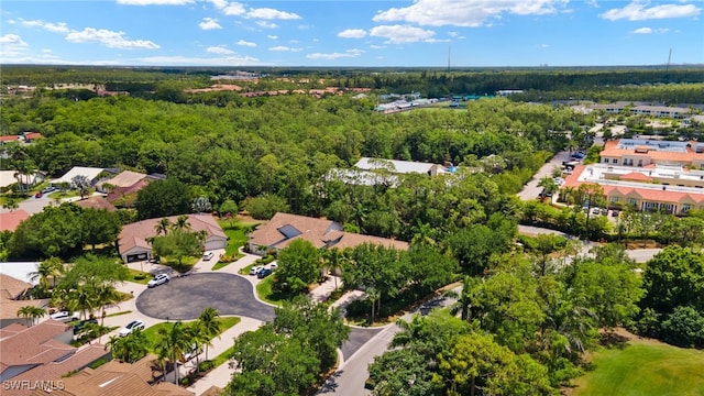 aerial view with a residential view and a view of trees