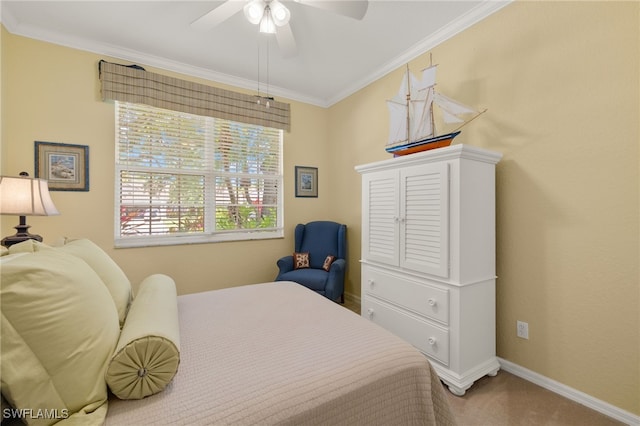 carpeted bedroom featuring crown molding, baseboards, and ceiling fan