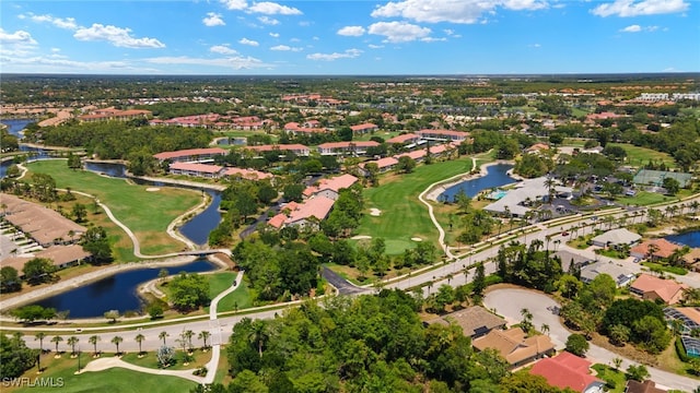 birds eye view of property featuring a water view, view of golf course, and a residential view