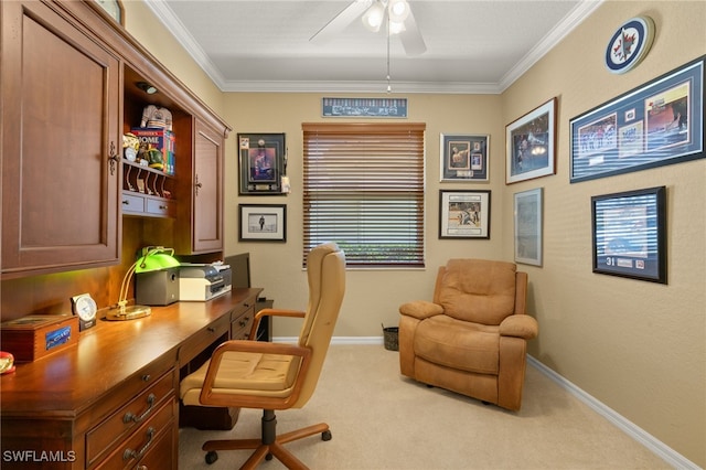 carpeted office space featuring baseboards, a ceiling fan, and ornamental molding