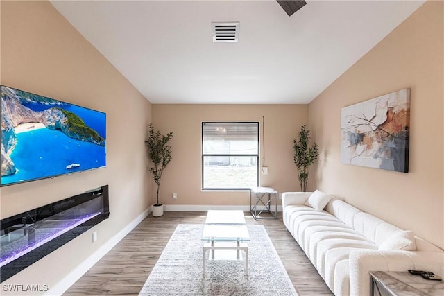 919 SE 16th St, Cape Coral, FL 33990 - living room featuring wood finished floors and baseboards