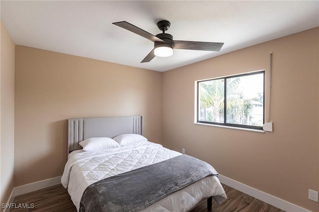 919 SE 16th St, Cape Coral, FL 33990 - bedroom featuring wood finished floors, baseboards, and ceiling fan