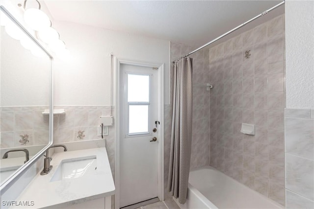 919 SE 16th St, Cape Coral, FL 33990 - bathroom with shower / bath combination with curtain, vanity, and tile walls