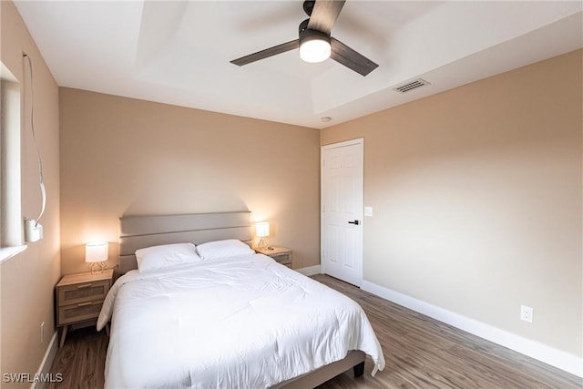 919 SE 16th St, Cape Coral, FL 33990 - bedroom with baseboards, wood finished floors, and a ceiling fan