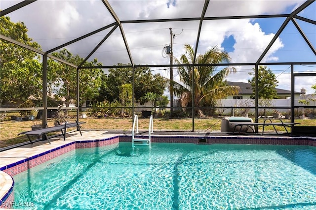 919 SE 16th St, Cape Coral, FL 33990 - view of swimming pool featuring glass enclosure and a patio