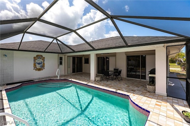 919 SE 16th St, Cape Coral, FL 33990 - swimming pool with a patio, a grill, and glass enclosure