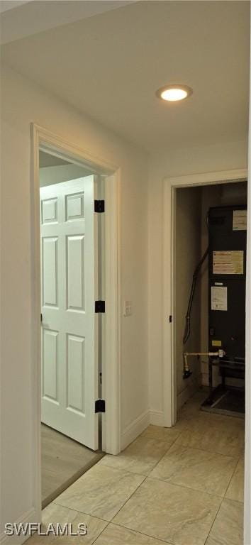 315 Cleveland Ave, Lehigh Acres, FL 33936 - hall featuring baseboards and light tile patterned flooring