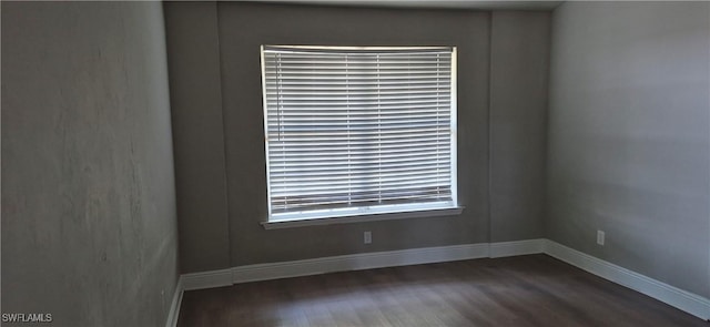 315 Cleveland Ave, Lehigh Acres, FL 33936 - unfurnished room with baseboards and dark wood finished floors